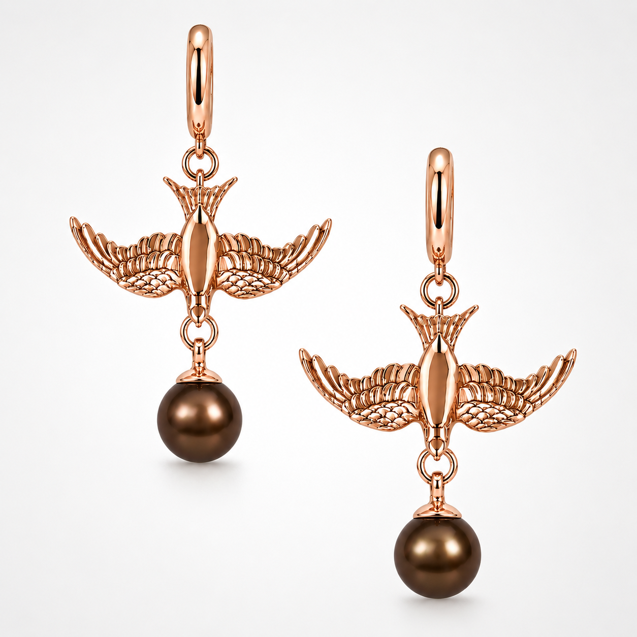 Gold swallow earring with pear charm