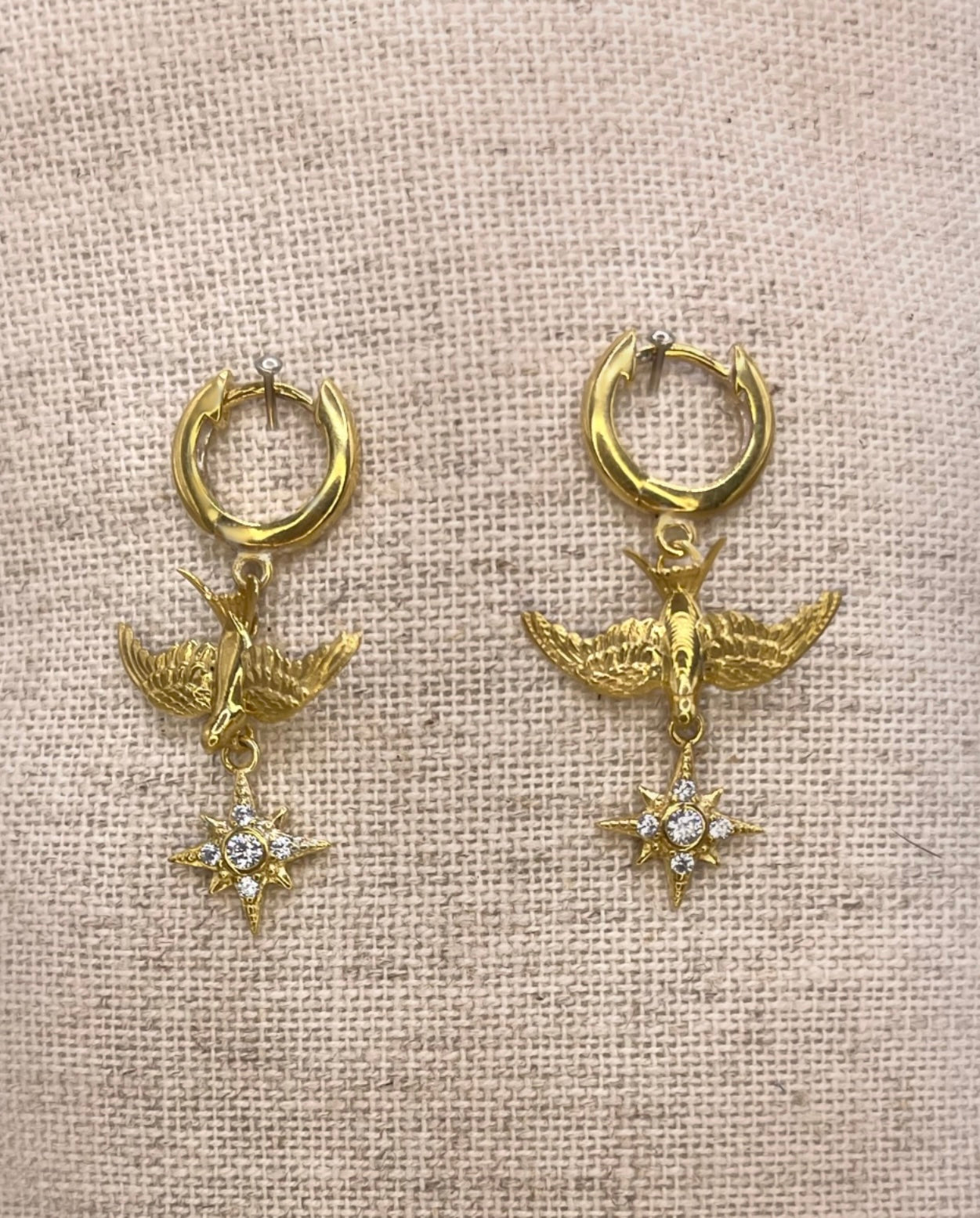 Small Gold swallow earrings, on clicker hoops with Northern Star Charm