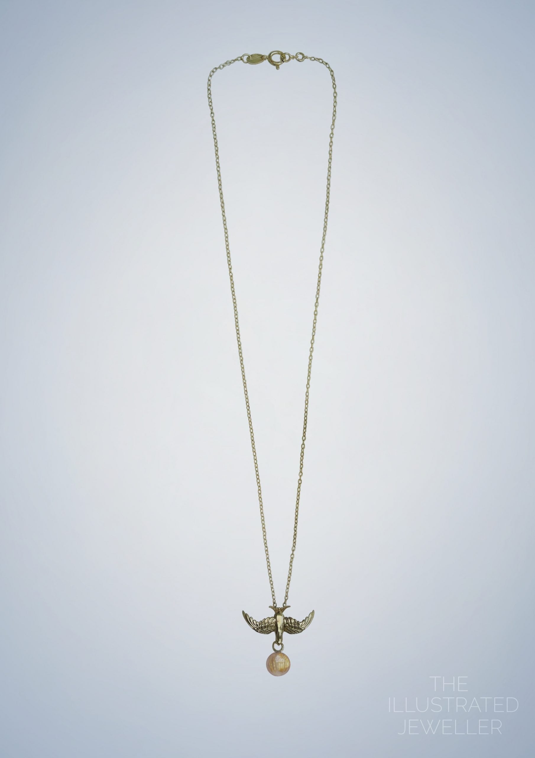 Gold swallow pendant, rutilated quartz gemstone, ultra thin trace chain