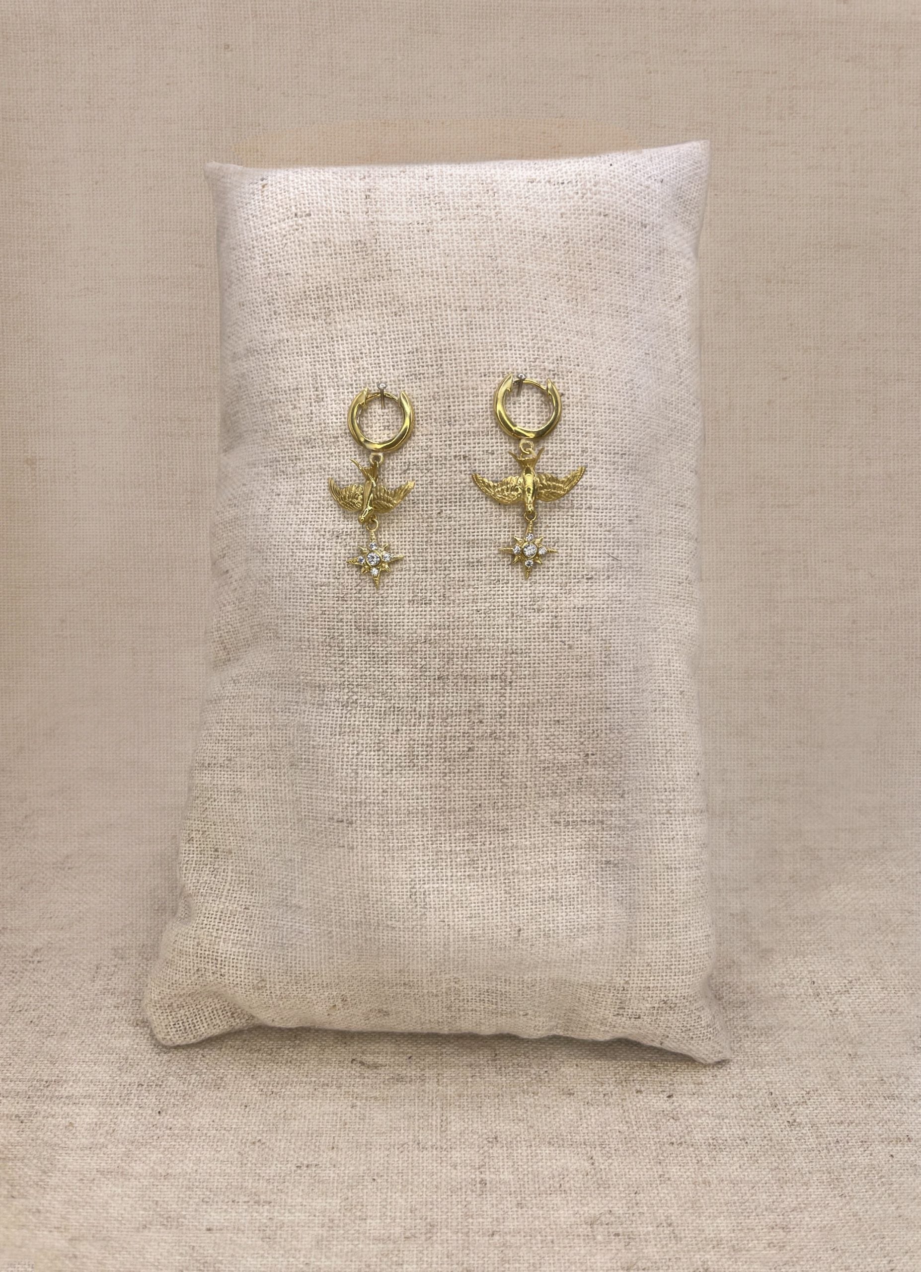 Small Gold swallow earrings, on clicker hoops with Northern Star Charm