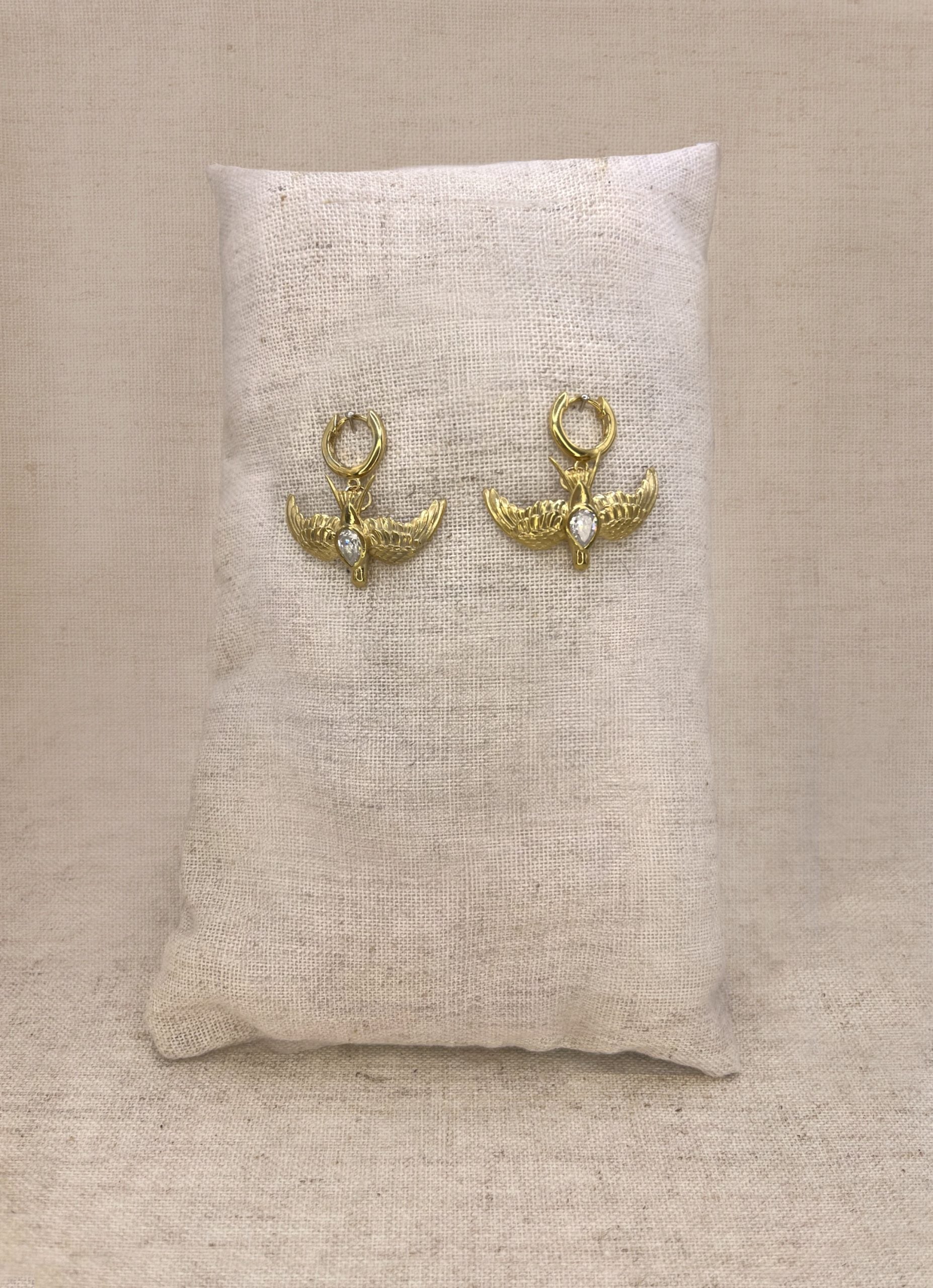 Large gold swallow on clicker hoops